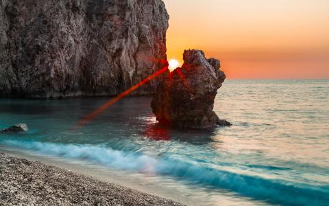 海，岩石，日落
